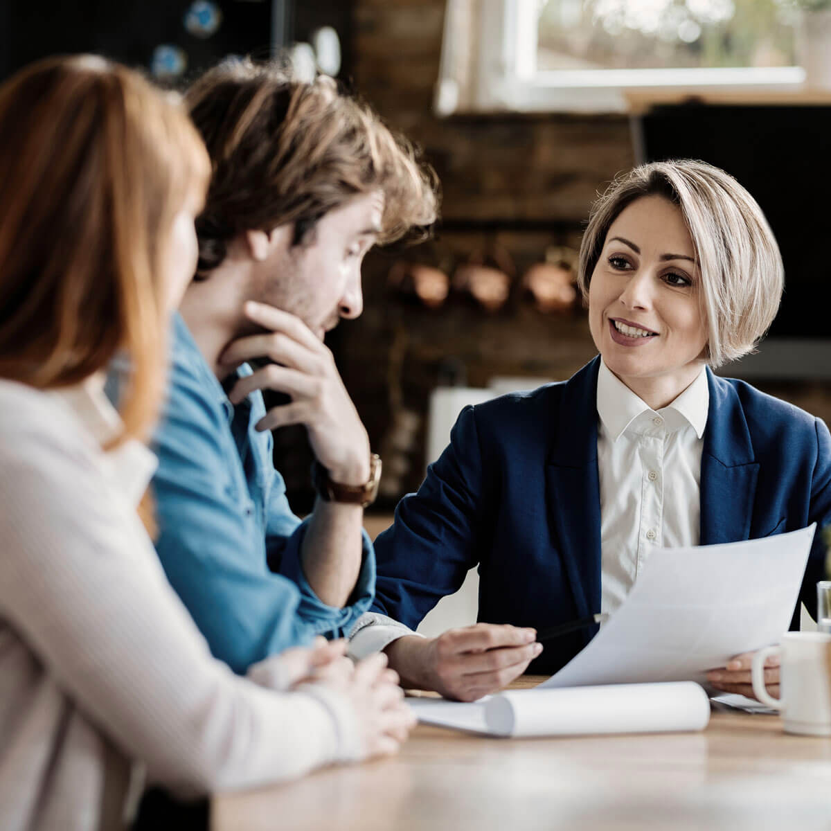 Couple consulting with City National Bank's Preferred Banking Financial Advisor